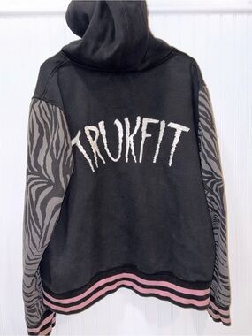 Trukfit Black Hoodie with Zebra-Patterned Gray Sleeves and Pink Trim